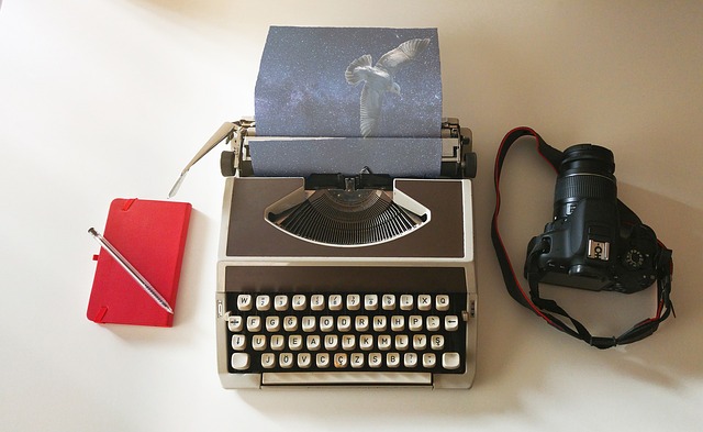 Typewriter notebook and camera